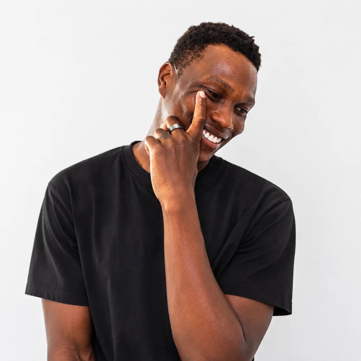 Man smiling while wearing the STARE ring